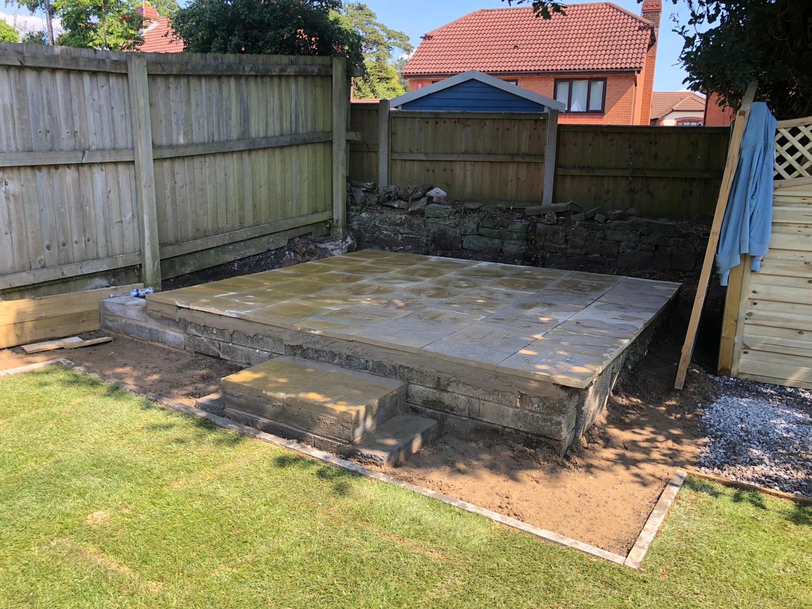 Sketty garden with paved platform to accomodate a hot tub